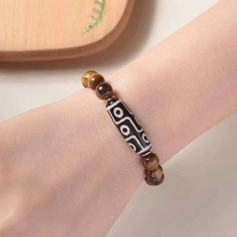 Tigereye bead Buddha rosary bracelet in a single circle ethnic style, showing simple and dzi bead colour options.