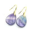 Geometric water drop crystal earrings in amethyst, pink crystal, obsidian, and opal colours on a white background.