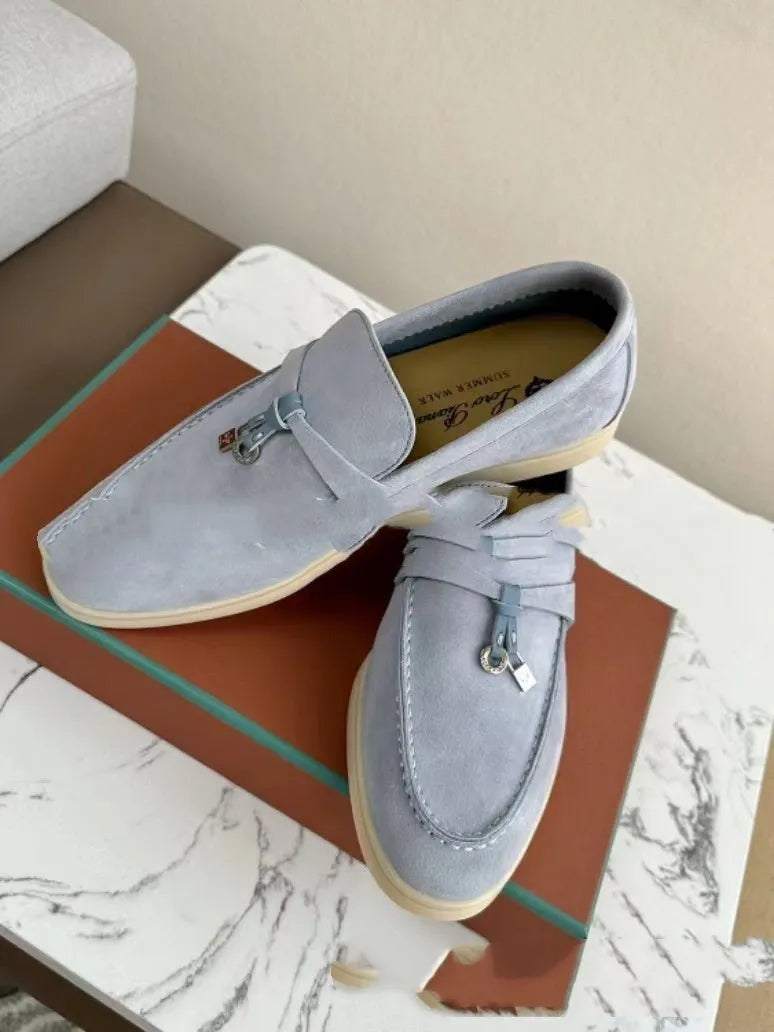 Slip-on high-top loafers in light gray with round toe and rubber sole.