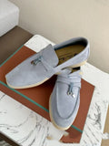 Slip-on high-top loafers in light gray with round toe and rubber sole.