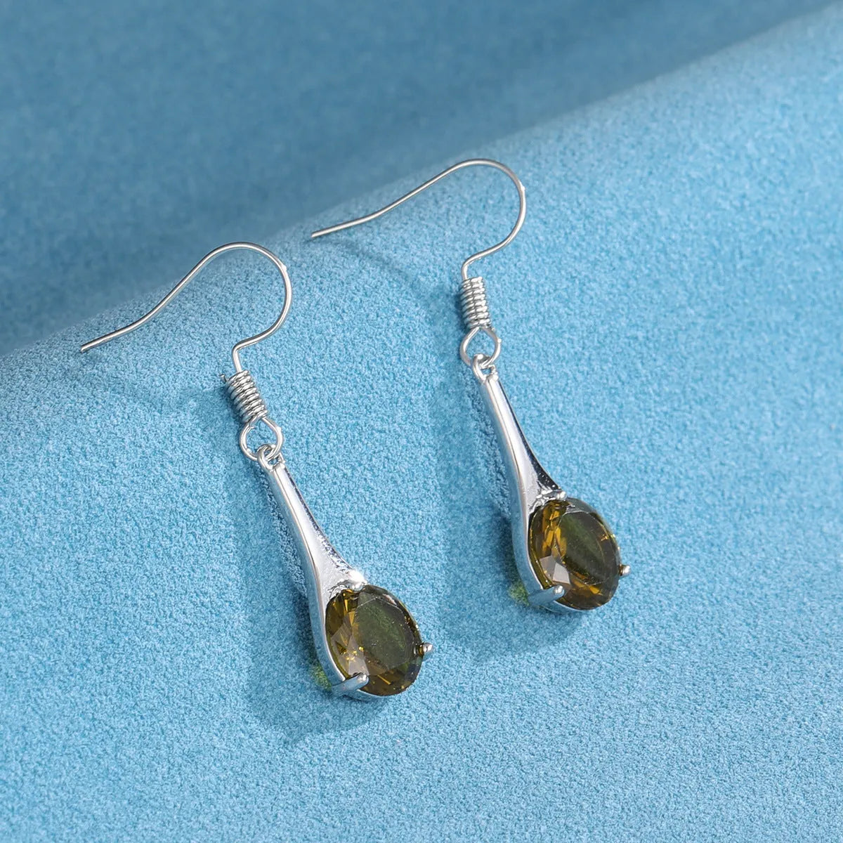 Olive green topaz water drop shaped earrings with electroplated finish and minimalist design