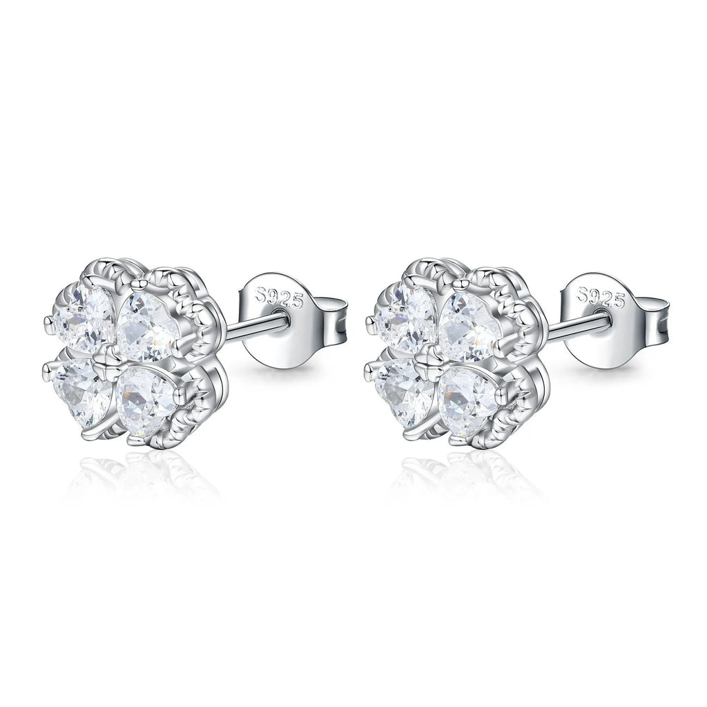 Close-up of women's heart-shaped 925 silver earrings with four-leaf clover zircon inlay, white gold colour finish.