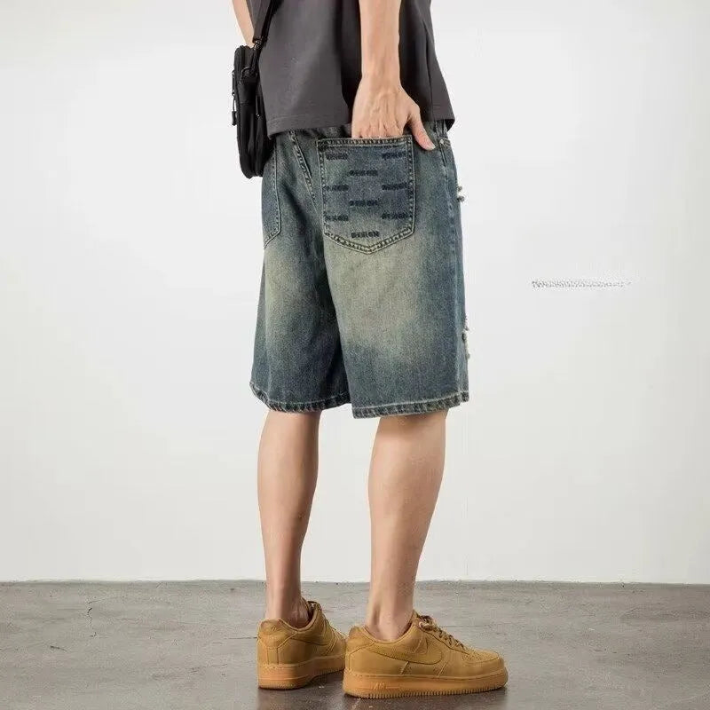 Blue men's denim shorts with a retro loose hole distressed design and a straight-leg cut