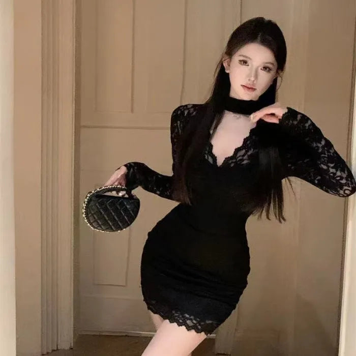 Women's black halter neck lace dress with hip wrap design and inner skirt
