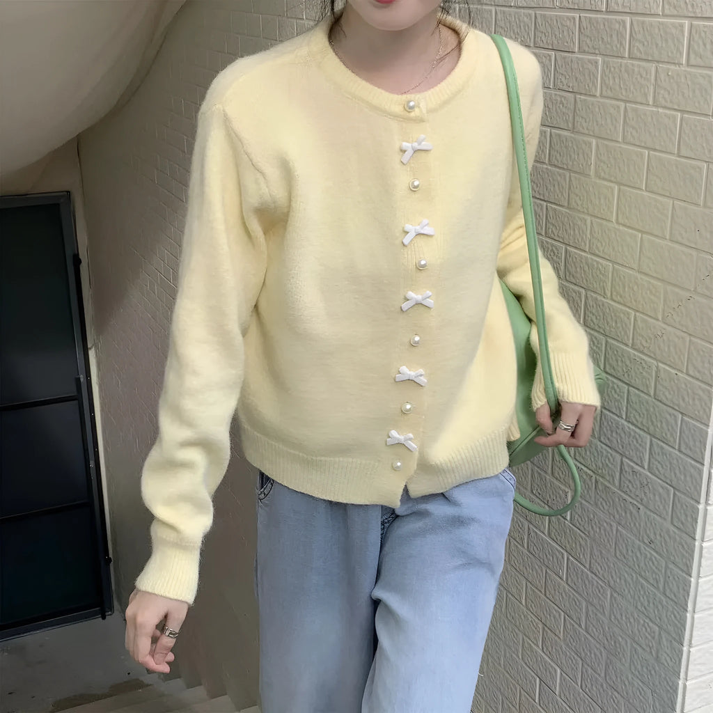 Women's cashmere cardigan sweater with pearl button bow detail in medium thickness for spring and autumn wear