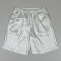 Men's black drawstring waist Tang suit shorts for Tai Chi, shown laid flat.