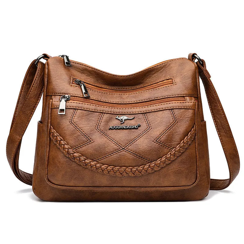 Soft PU leather crossbody shoulder bag in a horizontal square shape, shown in one of four colours: black, blue, red, or yellow.