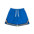Man wearing loose-fit grey polyester sports shorts with an elasticated waistband.