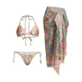 Creamy white women's floral bikini set with top, briefs, and matching skirt on a mannequin.