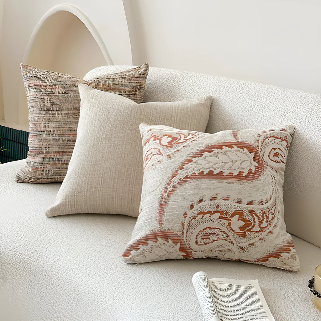 American-style jacquard cushion cover with a paisley and floral pattern in an amber colour.