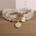 Gold-plated crystal bracelet for women with a Tianshan jade green ginkgo leaf pendant and rhinestones.