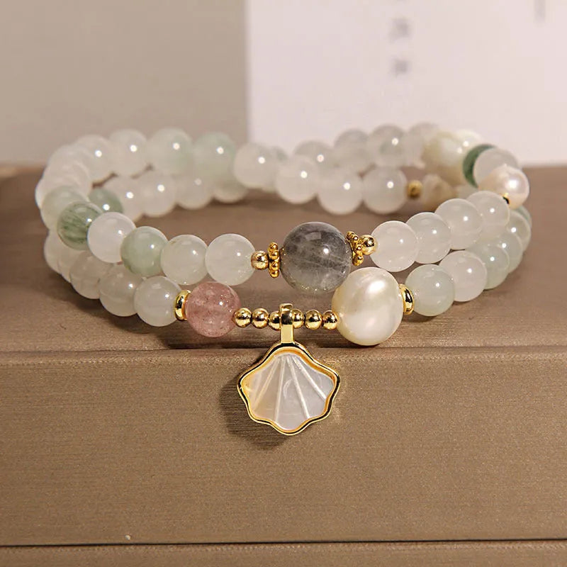 Gold-plated crystal bracelet for women with a Tianshan jade green ginkgo leaf pendant and rhinestones.