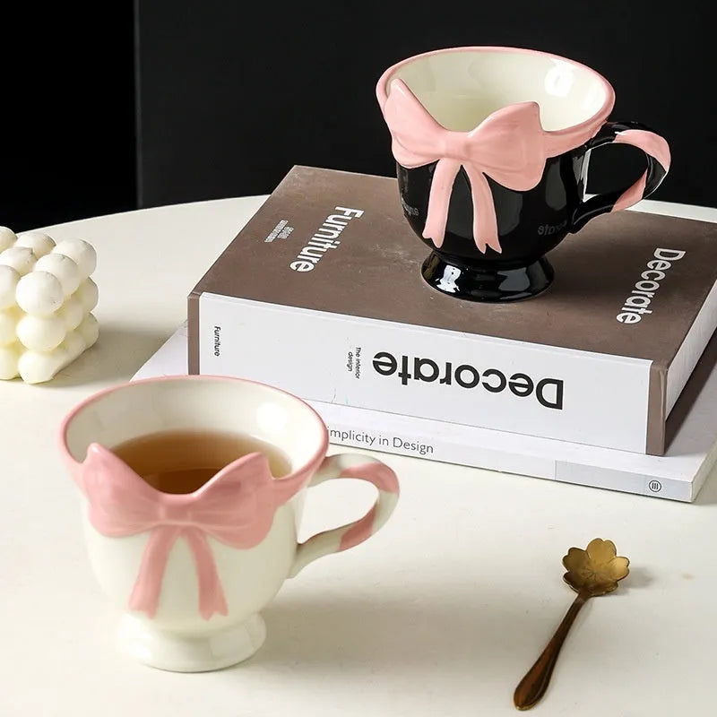 Ceramic mug with heart and bow design in black pink or white powder colour, 301-400ml capacity