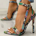 Blue women's high heels with serpentine hollow out design and buckle fastening.