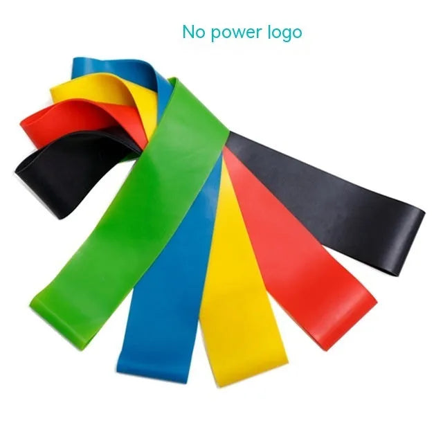 Set of five colour-coded TPE yoga tension straps laid out side by side, showing green, blue, yellow, red, and black options.