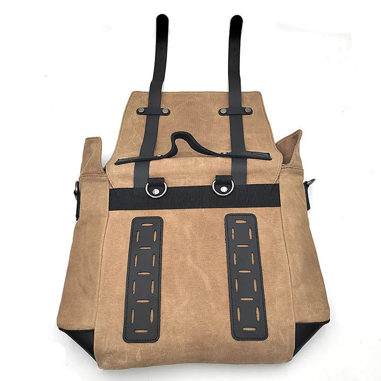 Motorcycle side pannier bag in black made from waterproof canvas with cowhide trim.