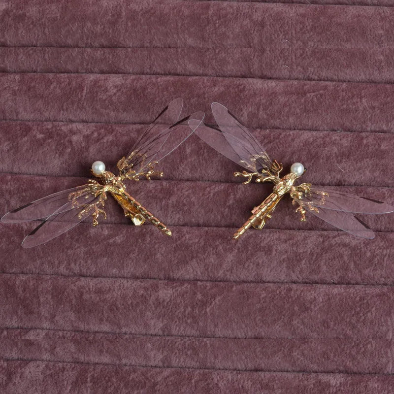 Golden electroplated alloy dragonfly side clip headdress for women.