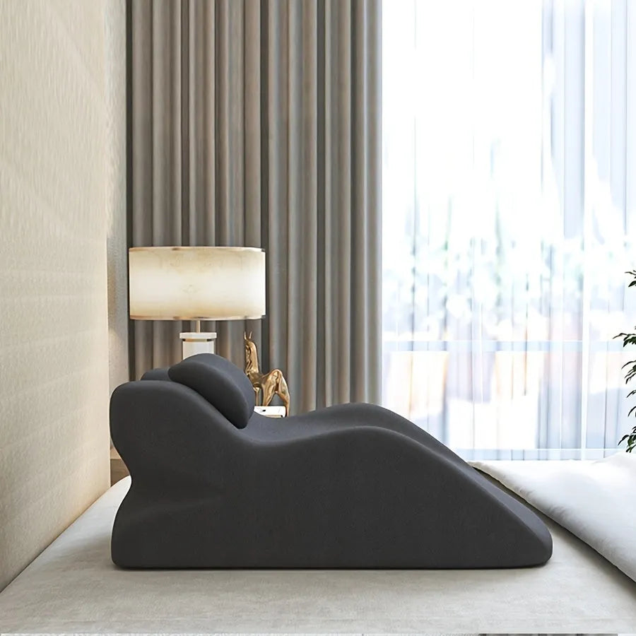 Wedge-shaped stomach sleeper pillow with arm slots shown in light grey colour