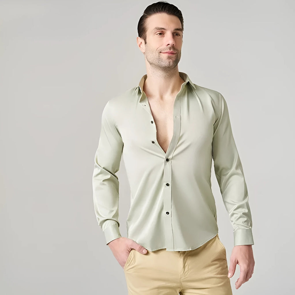 Man wearing a stretch long sleeve polyester work shirt in a solid colour.