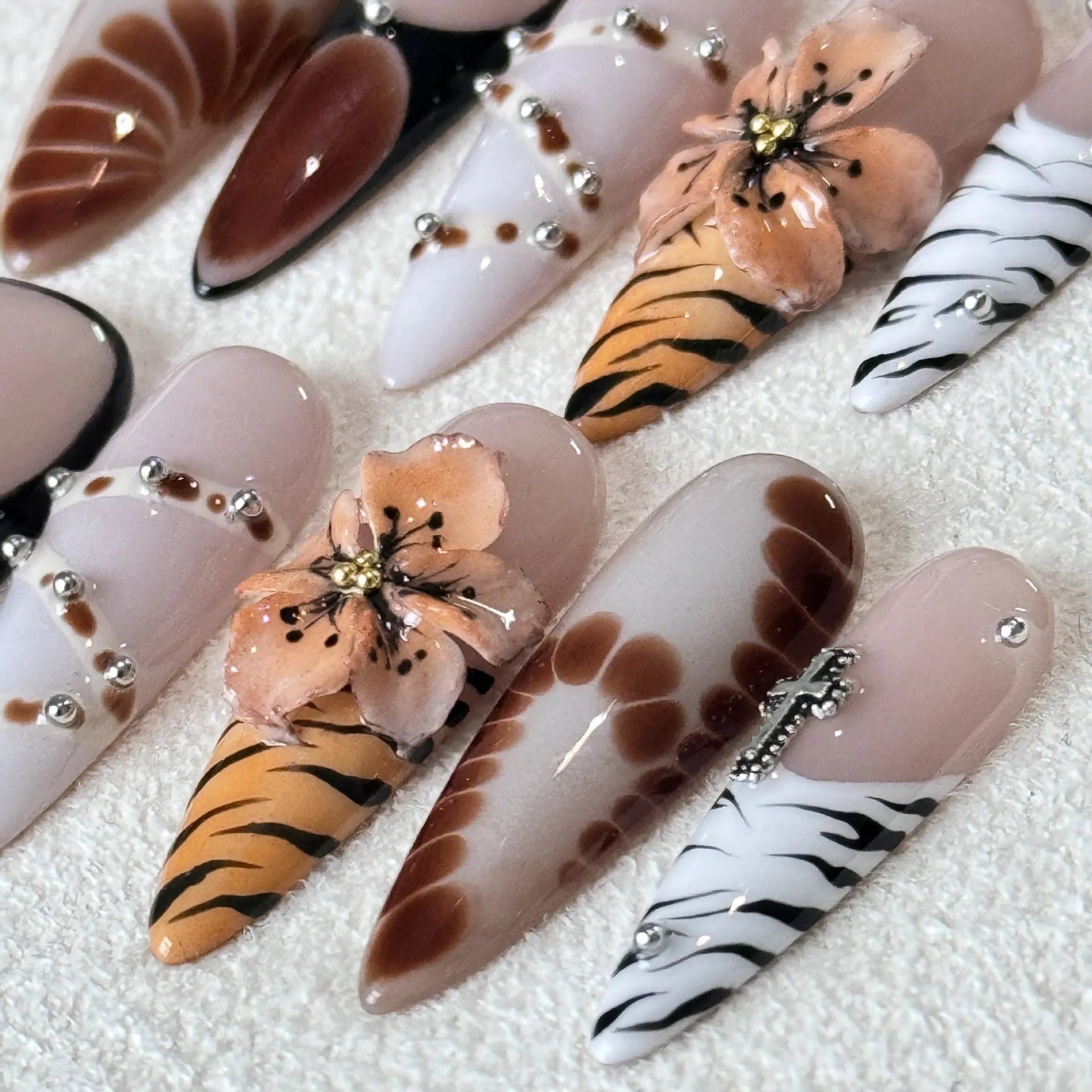 Leopard print nail stickers with floral and cross designs in XS S M L sizing options