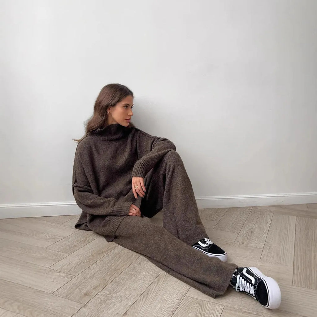 Women's dark grey side-slit sweater with matching trousers two-piece suit on hanger