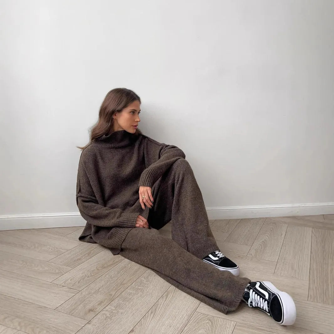 Women's dark grey side-slit sweater with matching trousers two-piece suit on hanger