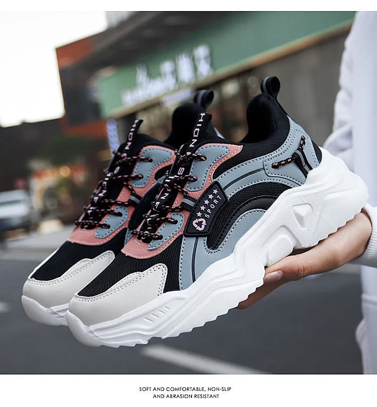 White women's casual sports shoe with mesh upper, thick PU sole, and buckle strap.