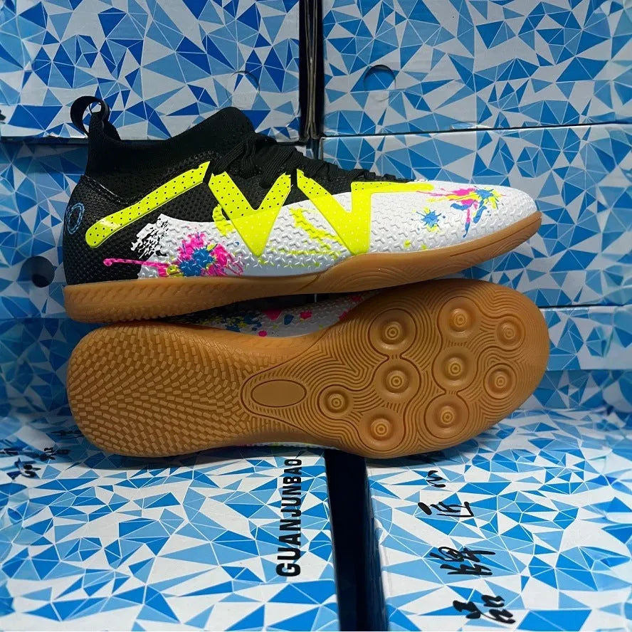Low-top men's football boots in black and yellow with a PVC upper and rubber studded outsole.