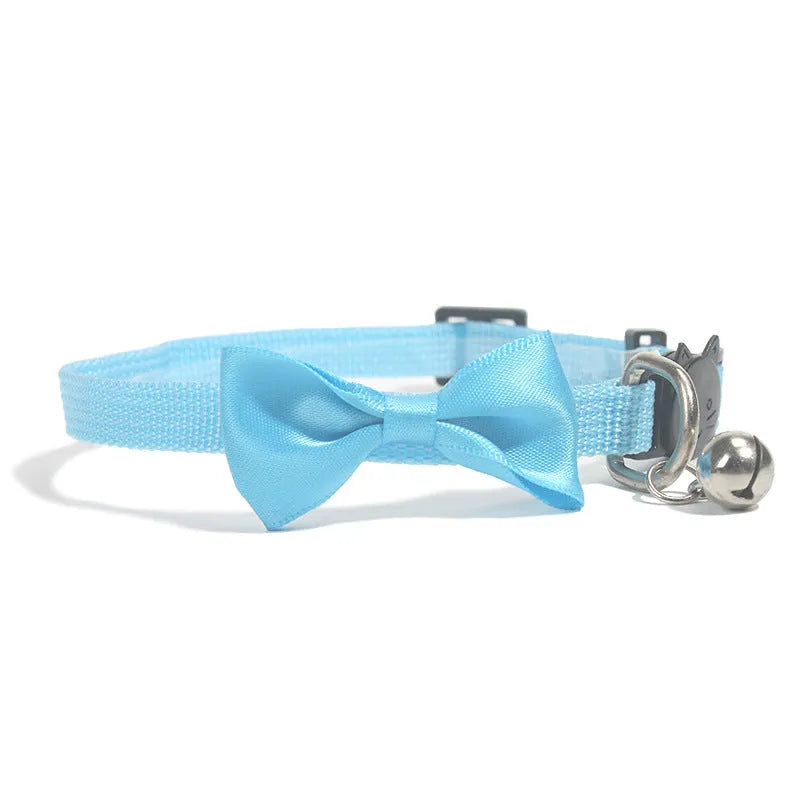 Adjustable striped nylon cat collar with bell in various colors including red, green, and blue