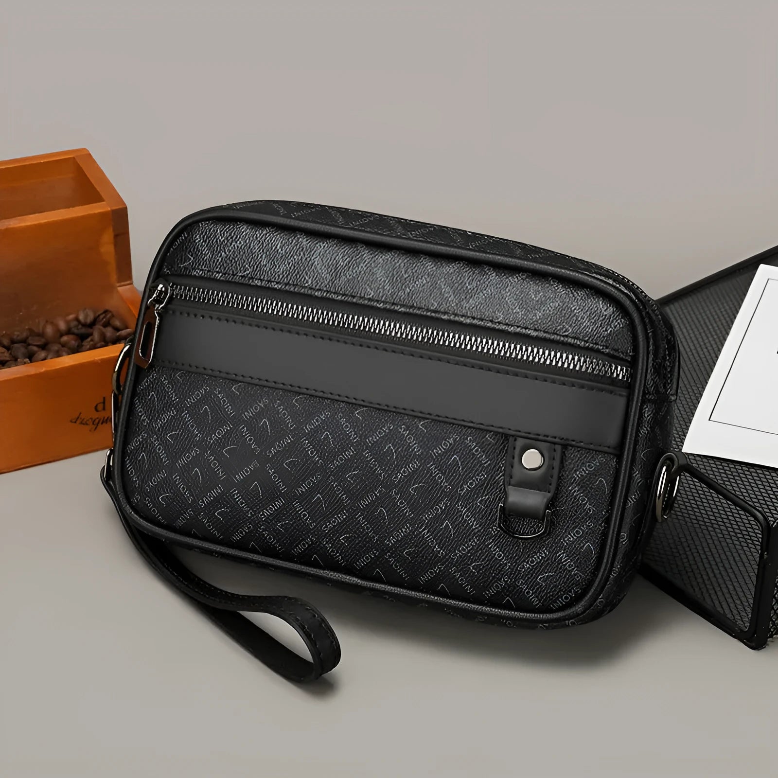 Men's black horizontal messenger bag with geometric pattern and shoulder strap