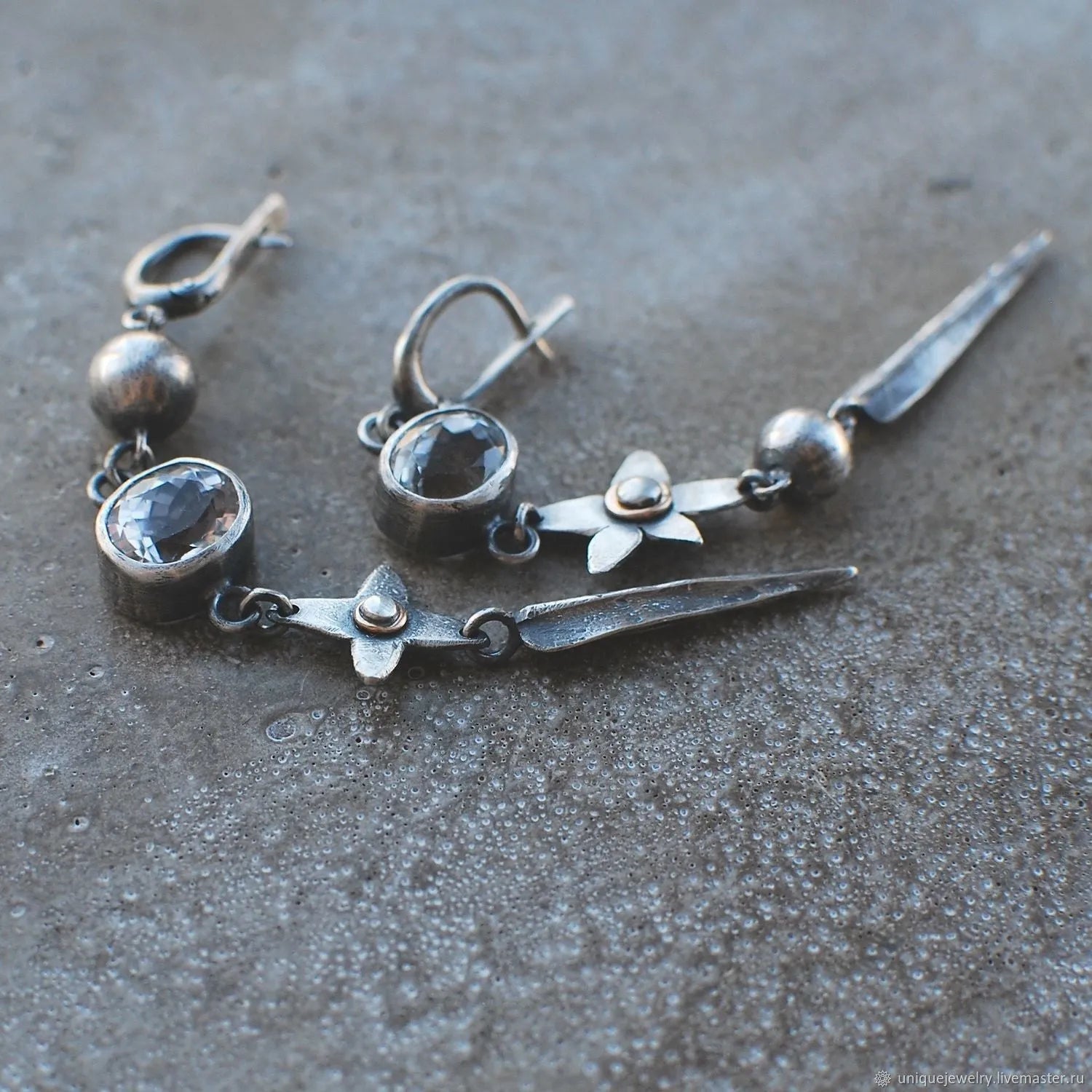 Long geometric XINGX design pendant earrings in antique silver tone with rhinestones.