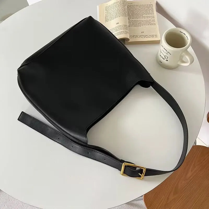Soft PU leather ladies shoulder bag with swing threads in black or brown