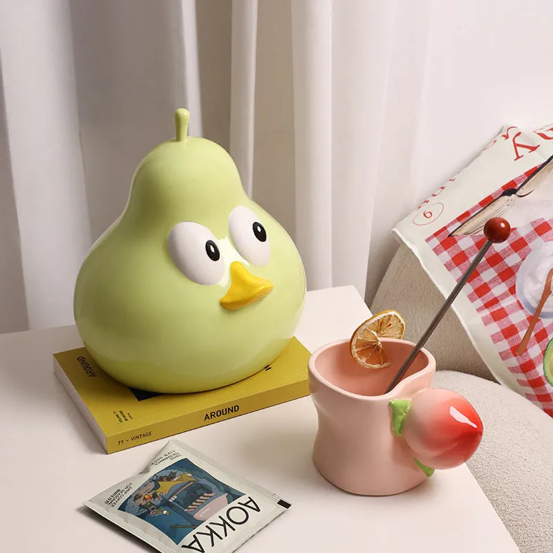 White porcelain ceramic tissue box with pear shape and cute animal design in green colour