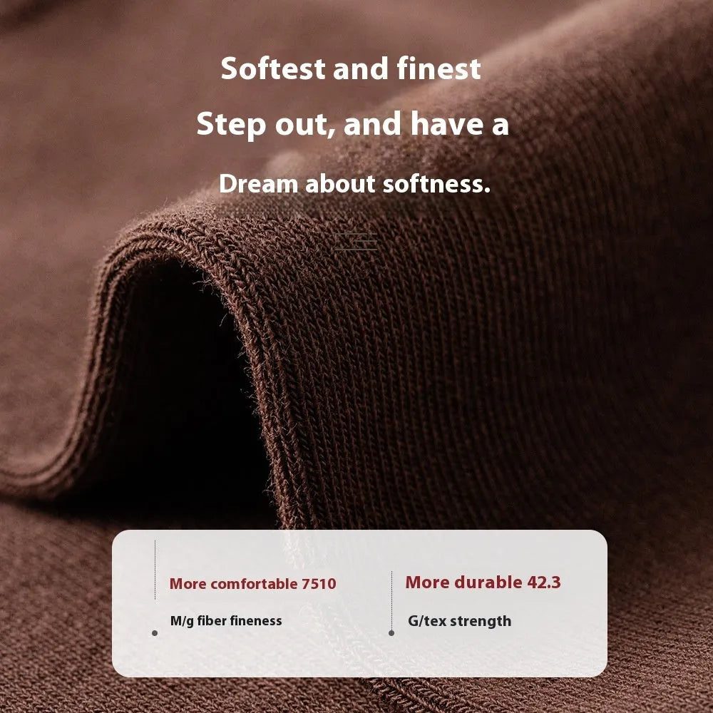 A pair of solid colour men's mid-calf socks in combed cotton, shown in a light grey shade.