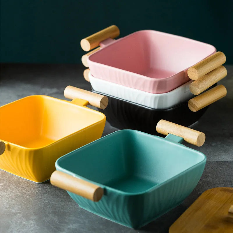 Modern ceramic bowl with irregular organic shape and coordinating lid in porcelain
