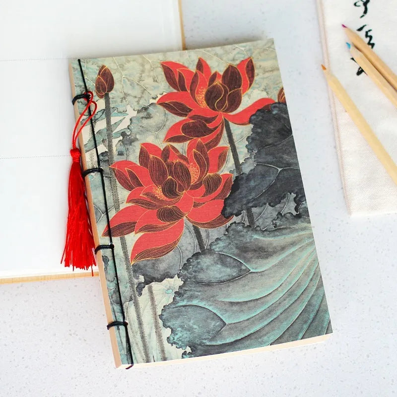 A5 antique wire-bound notebook with glossy embossed cover featuring a retro painting design, shown open.