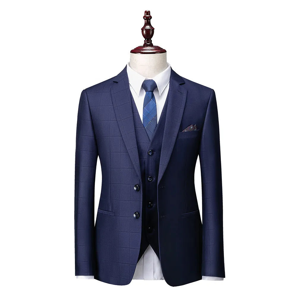 Men's navy blue slim fit plaid three-piece suit with jacket, vest, and trousers on a hanger.
