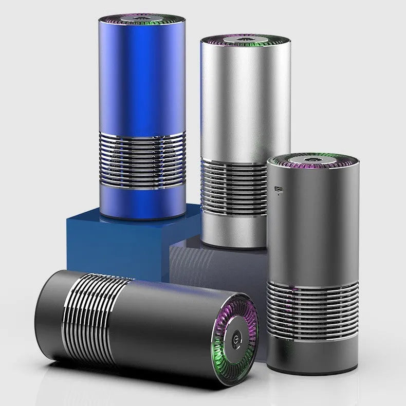 Compact black car air purifier with aluminium alloy body, shown with power cord.