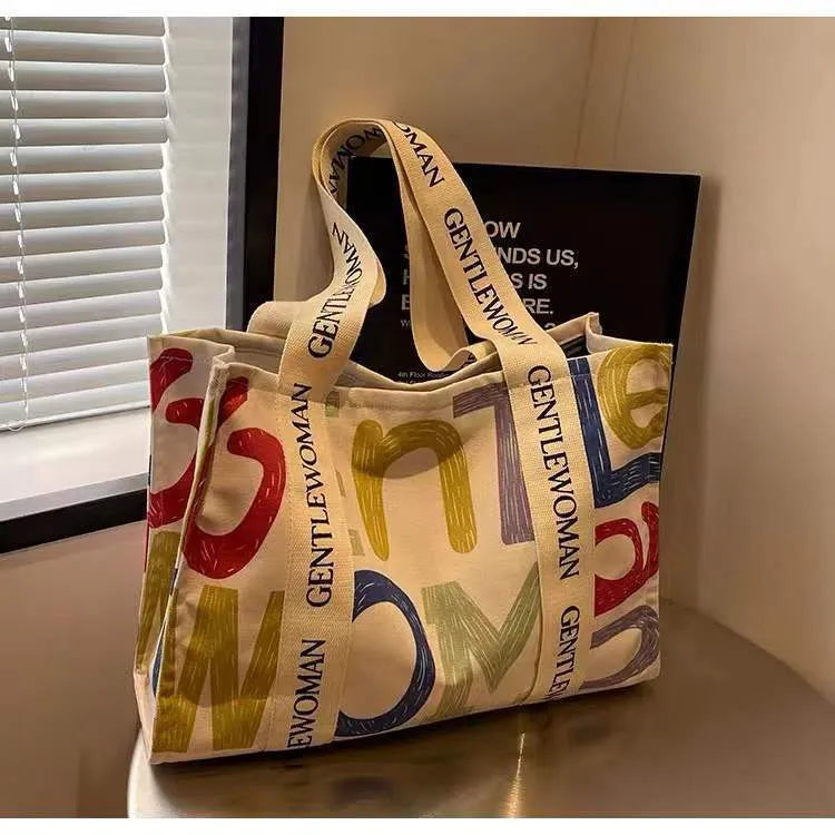 Canvas tote bag with printed design, large capacity for shopping and travel