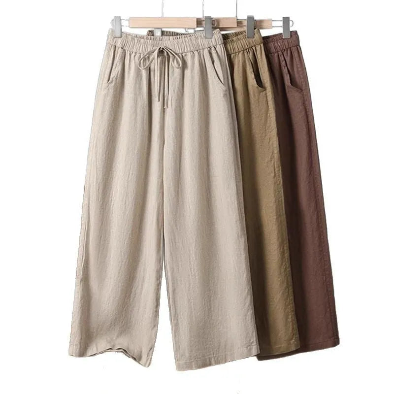 Women's straight-leg casual trousers with elastic waist and drawstring detail in polyester fabric