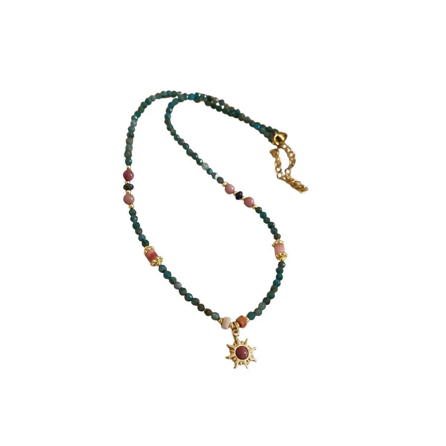 Freshwater pearl necklace with geometric sun stone pendant on adjustable clavicle chain