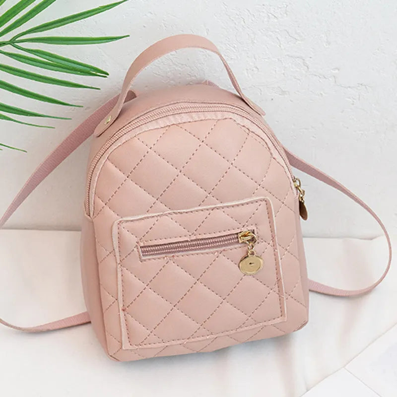 Girls' hard backpack with embroidery in white, black, or pink colours, showing sandwich pocket and soft handle