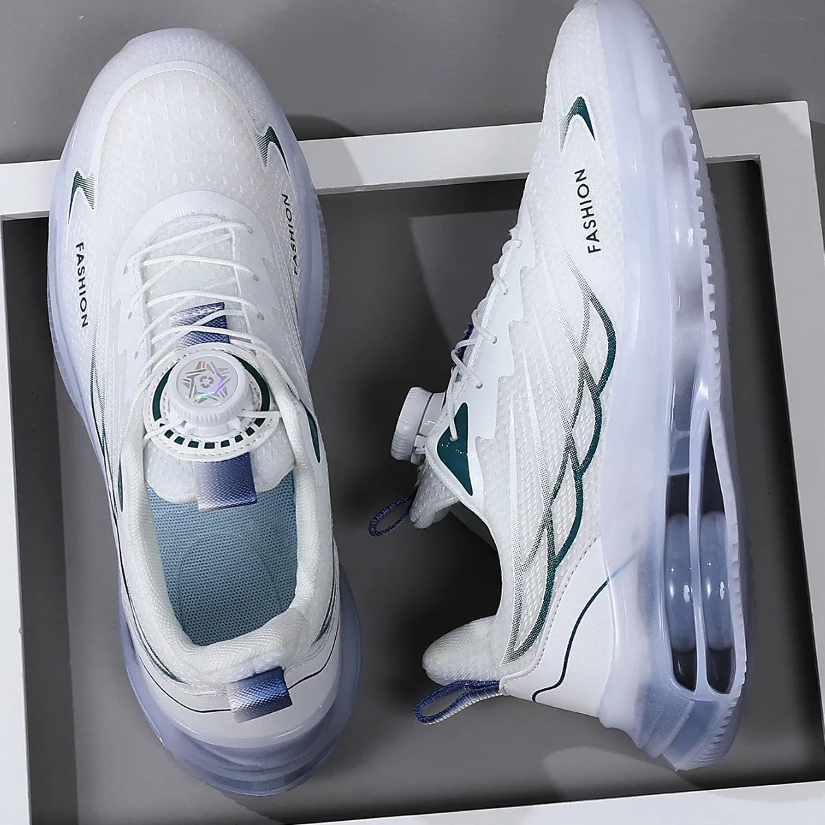 White men's low-top casual sneakers with rotating button on lace-up front and mesh upper.