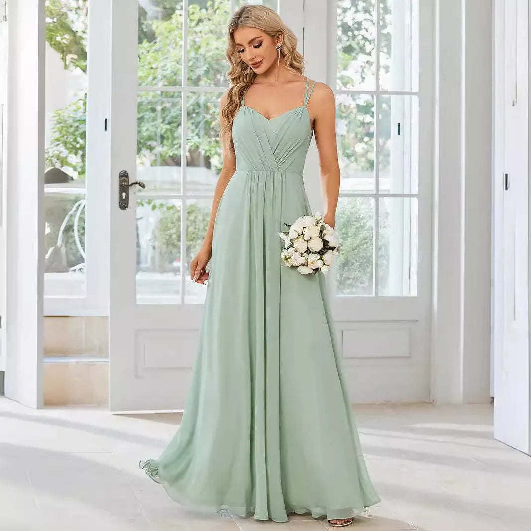 Women's long sleeveless A-line dress with pleated skirt and sling neckline in light green colour