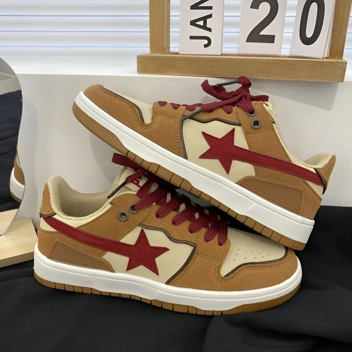 Brown women's low-top platform sneakers with sequin trim and round toe, shown from the side.