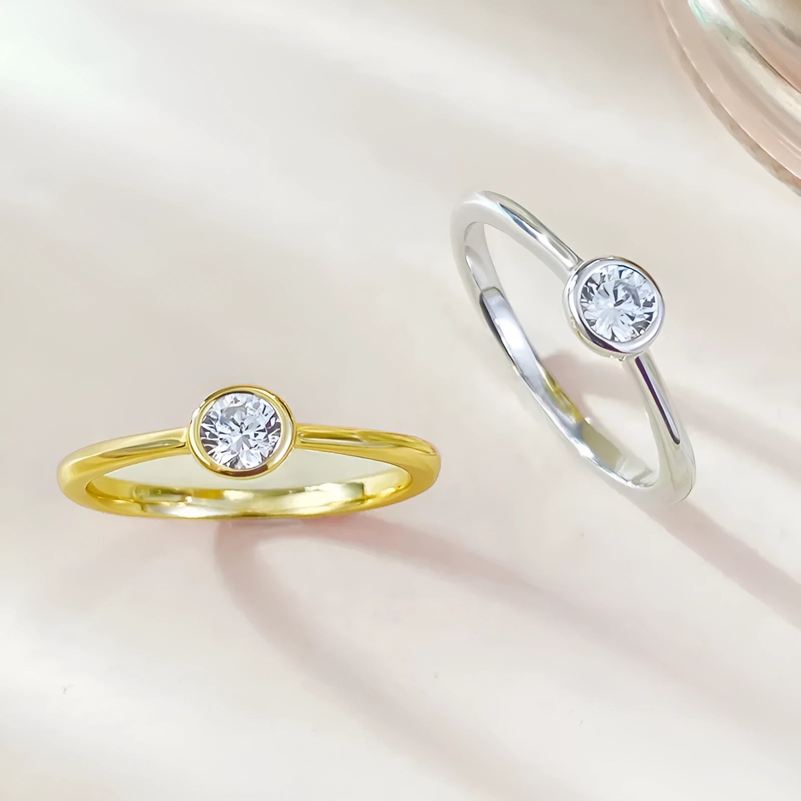 Minimalist silver crown-shaped ring with linear engraving detail in gold or platinum electroplated finish.