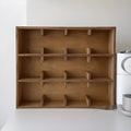Solid birch wood multi-grid cup storage rack in meridian colour on a kitchen counter.