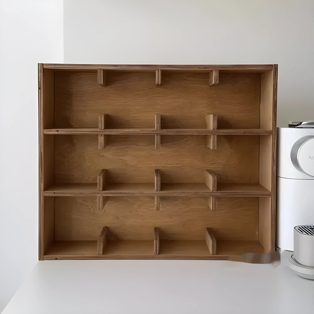 Solid birch wood multi-grid cup storage rack in meridian colour on a kitchen counter.