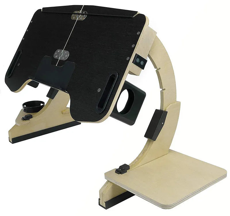 Wooden folding laptop table with adjustable angle on a bed, in black finish.