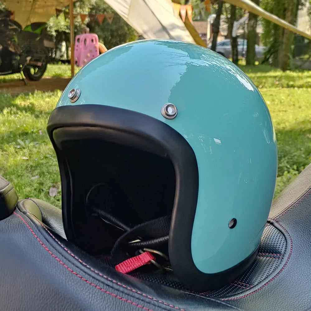 Retro-style half-shell motorcycle helmet in fibreglass, shown in a cement grey colour option.